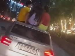 Boys and girls did stunt in moving car