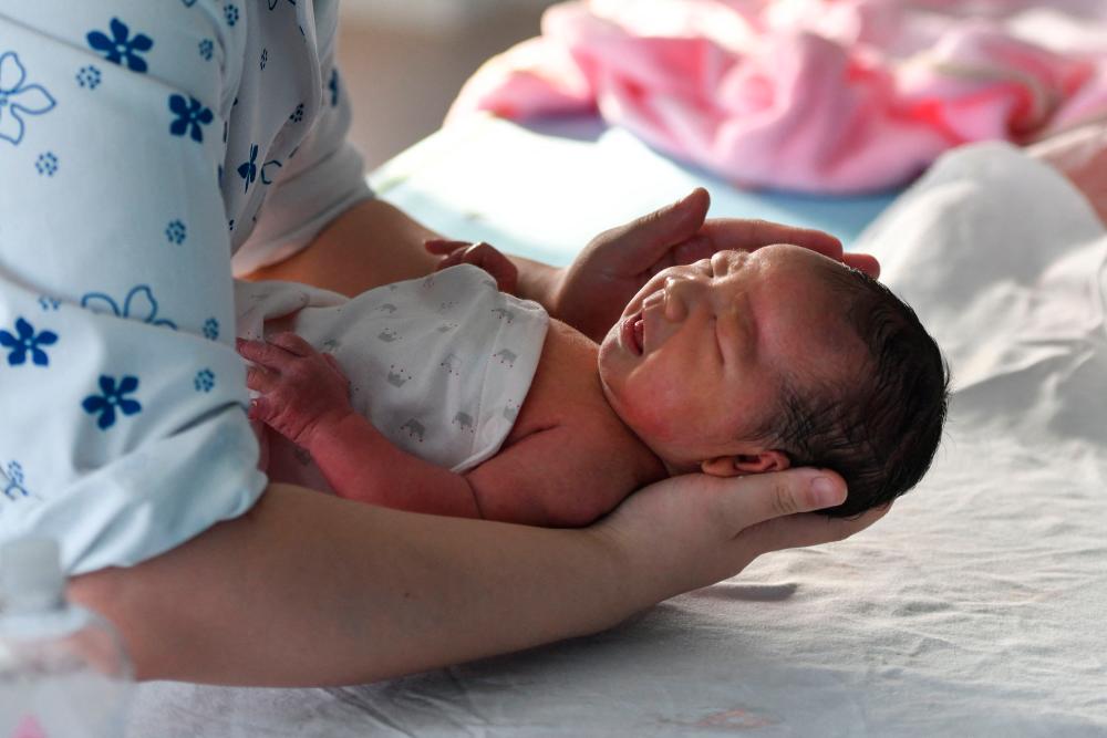 new delhi,  population decline, China announced  