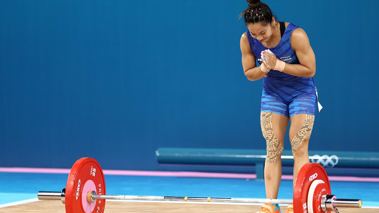 Mirabai shines at the Asian Games; India wins silver in weightlifting.